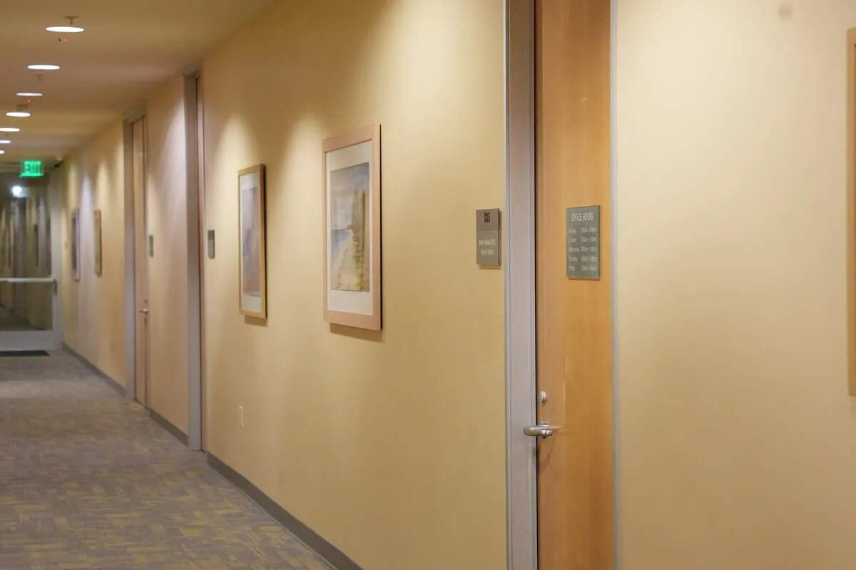 The ground-floor corridor inside 1183 E Foothill Blvd, leading to the suite door
