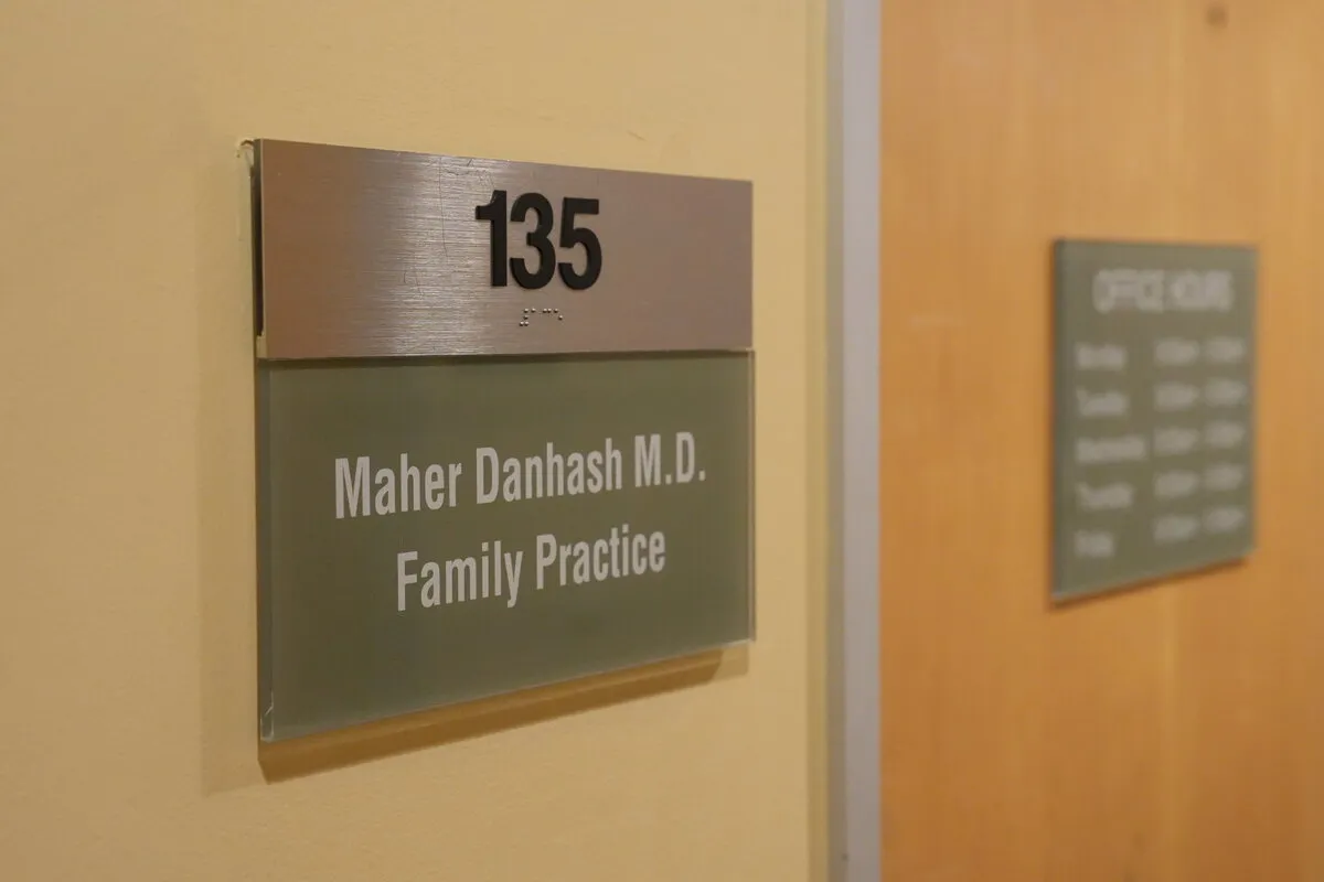 The suite door sign reading "135 — Maher Danhash M.D. Family Practice"